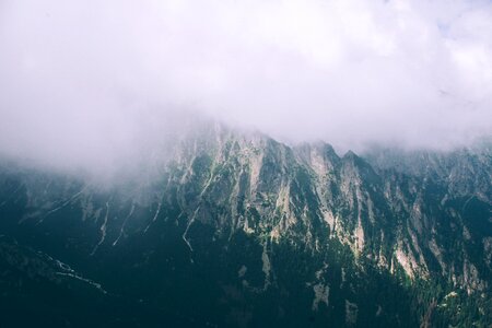 Clouds covering mountains photo