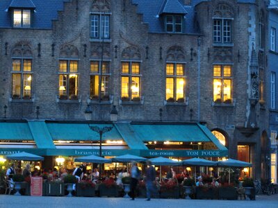 People enjoy outdoor dining on the street