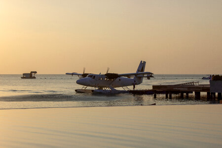 Sea Plane Disembarking at Dawn photo