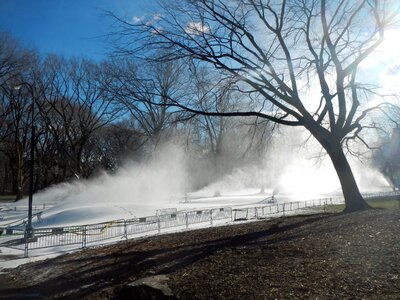 Snow-making outside city photo