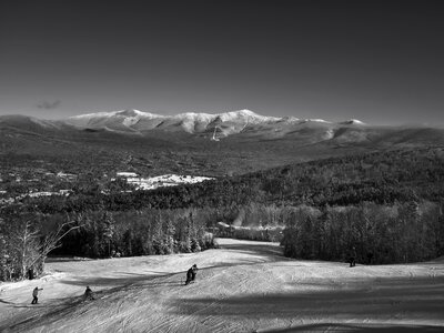 Scenic skiers skiing photo
