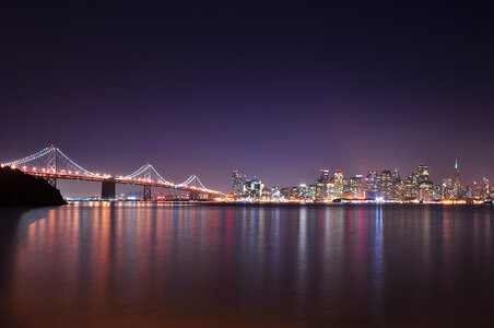 A Night View with City Lights Reflecting in a Bay photo