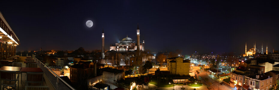 Night Cityscape in Istanbul, Turkey with moon and the Hagia Sophia photo
