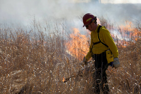 Firefighter torching field
