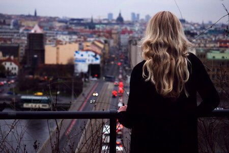 Woman overlooking the city of Prague, Czech Republic photo