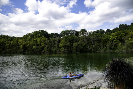 Man rowing a canoe in the lake photo