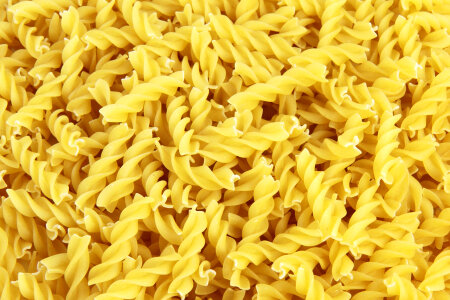 Uncooked Dry Yellow Fusilli Pasta photo