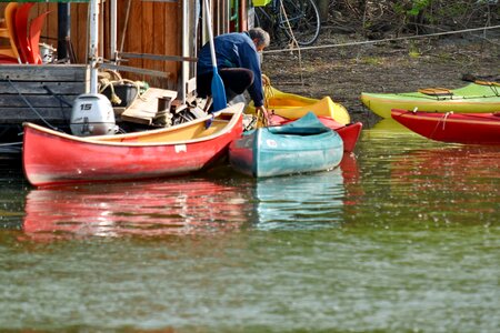 Canoe man riverbank photo
