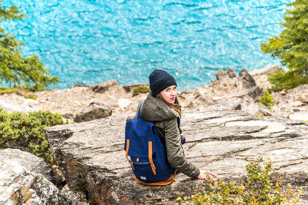 Girl Traveler with Backpack Enjoying View photo