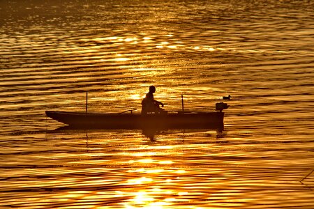 Fisherman golden glow sunset
