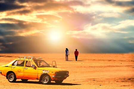 Off-road car driving on a desertic landscape. photo