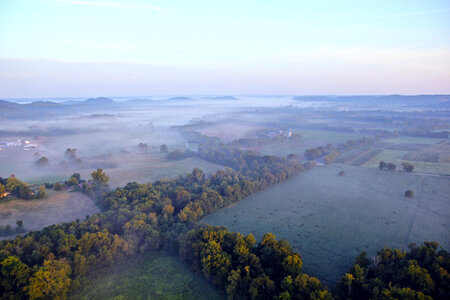 Aerial View of forests under fog photo