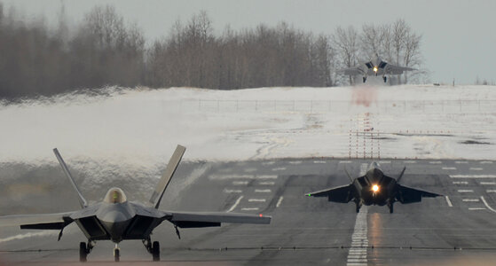 Three F-22 Raptors landing photo