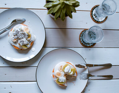 Pancakes with Yoghurt, Kiwi and Banana on Wooden Background Top View photo