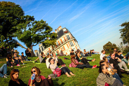 People Sitting on the Grass, Montmartre Hill, Paris photo