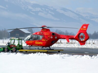 The rescue helicopter ready to evacuate skiier photo