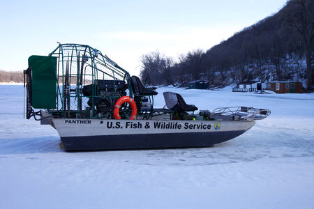 Service airboat sits on ice photo