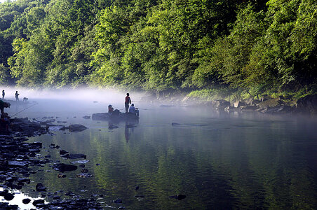 Kids fishing in the mist photo