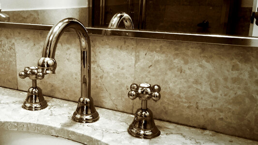 bronze faucet in the bathroom washstand photo
