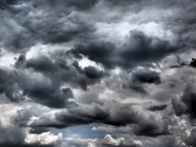 Dramatic clouds form dark clouds photo