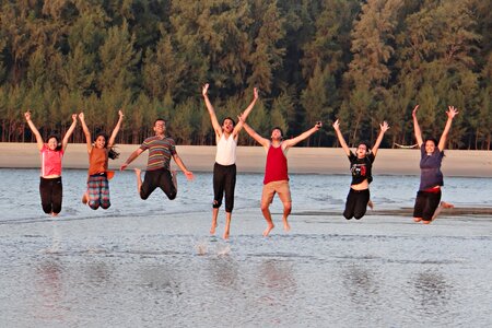 Happy people beach frolic photo