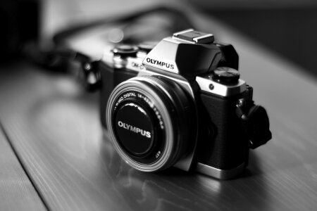 Old retro camera on vintage wooden boards abstract background photo