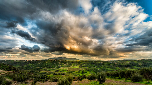 Dramatic Clouds and skies over Orchards and Farms photo