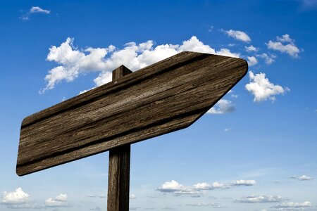 Blank Directional Signpost against Blue Sky with Copy Space photo