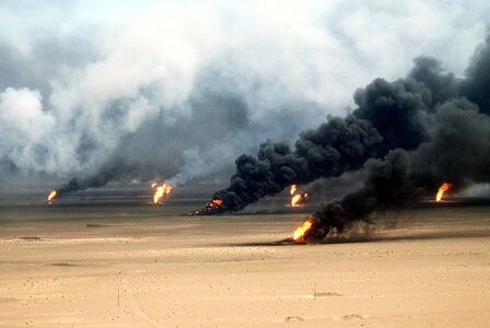 Oil well fires rage outside Kuwait City in 1991 in the Gulf War photo