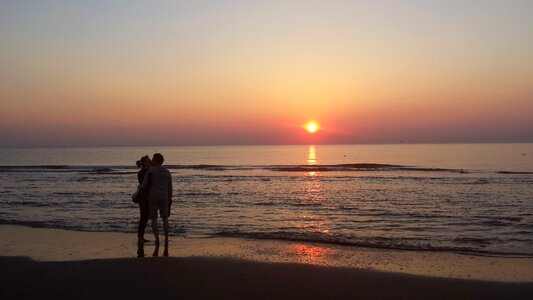Embrace sunset together photo