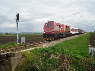 A train passing around Vrnica in Kosovo photo