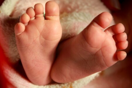 Arm baby barefoot photo