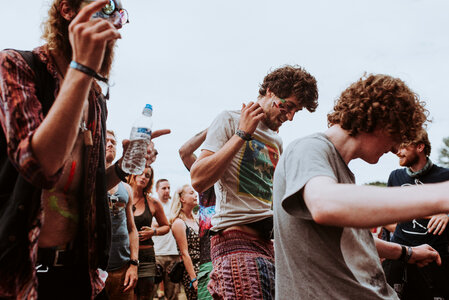Group of Hippies Dancing at the Outdoor Festival photo
