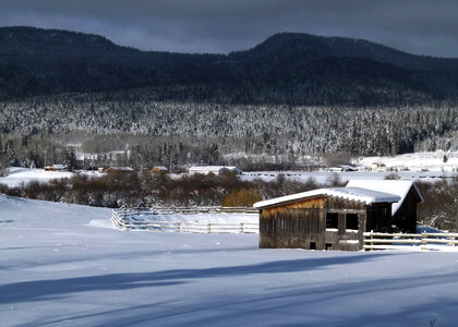 Snowy winter landscape with houses in British Columbia, Canada photo