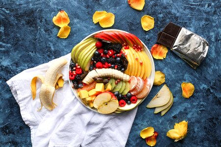 Colorful fruit platter and dark chocolate photo