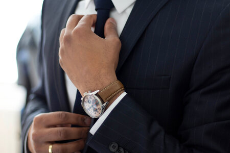 Businessman Adjust Necktie His Suit photo