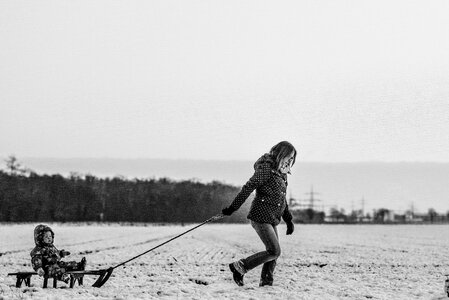 Woman Child Snow Sledge photo