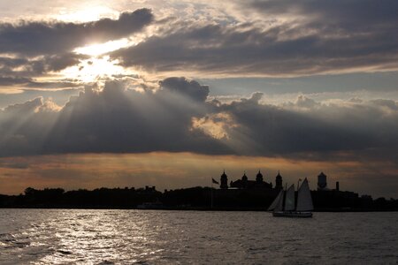 Sunset sailboat reflections photo