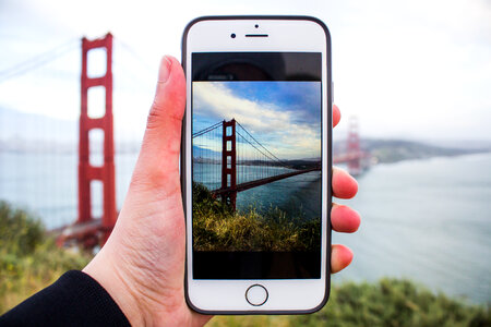 Person Taking Picture with iPhone of the Golden Gate Bridge photo