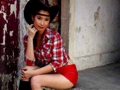 Asian female model in cowboy outfit photo