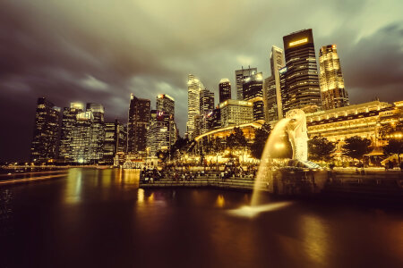 Singapore skyline and fountain at night photo