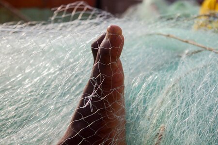 Fishing nets feet weaving photo
