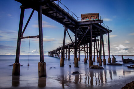 Long Exposure Seaside View with a Long Pier photo