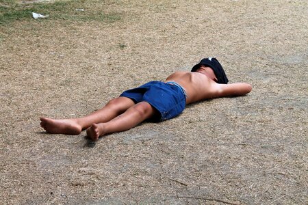 Fatigue sleep lying on the ground photo