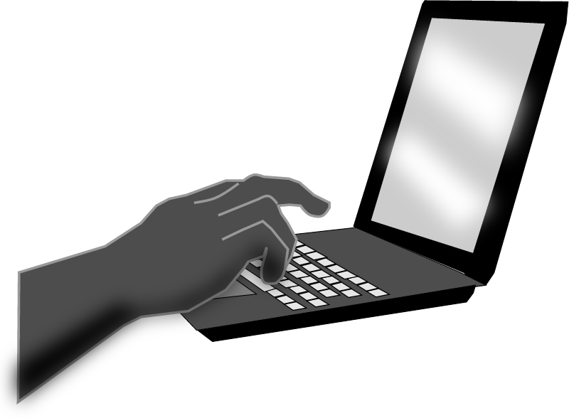 Hand Typing on Laptop