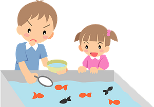 Brother and sister scooping goldfish