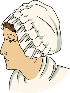 White bonnet plaited around the face tied on top of the head forming a trimming