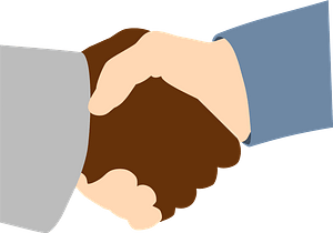 Handshake between African and Caucasian