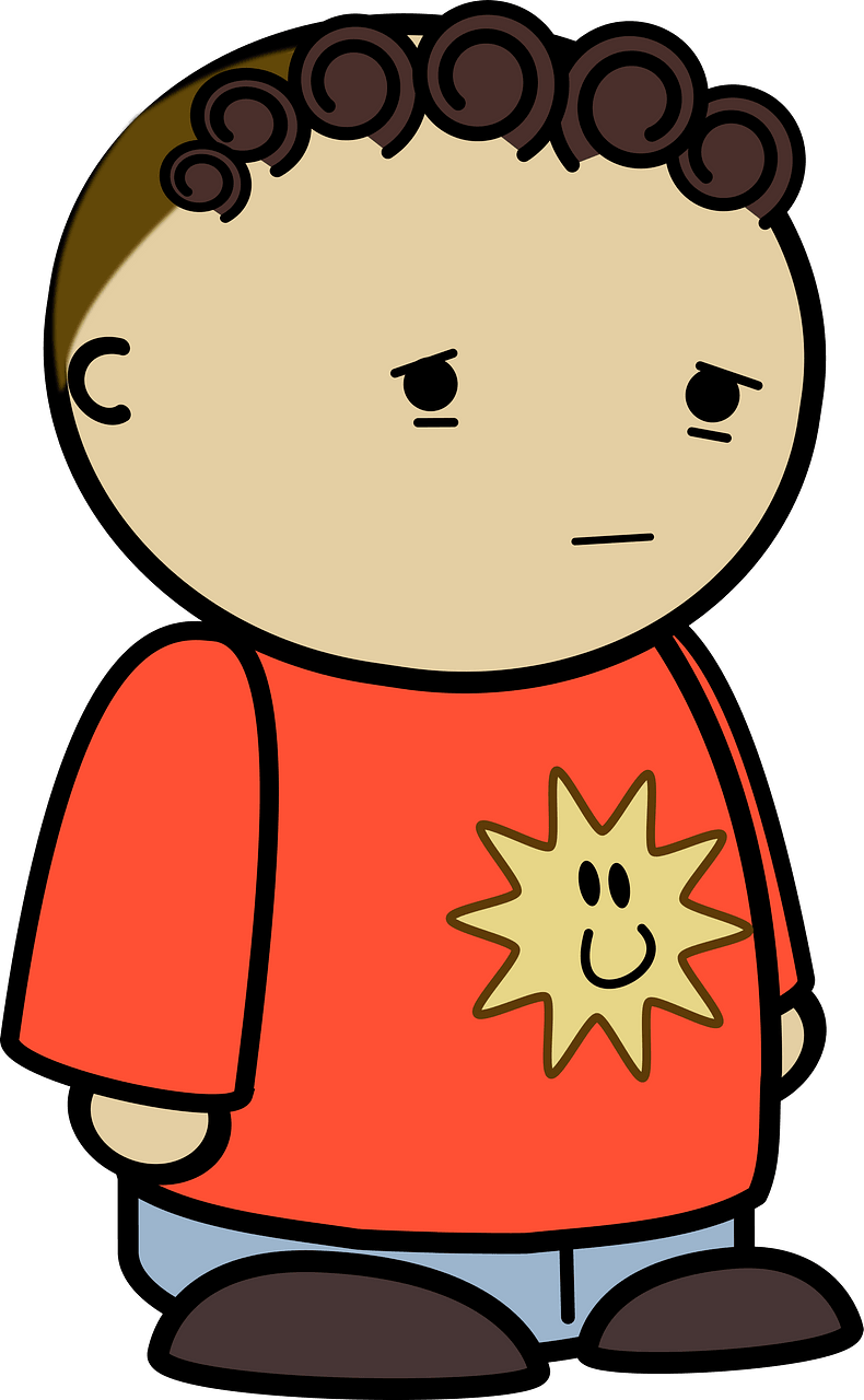 Curly haired boy in a orange shirt, sad face, to the side
