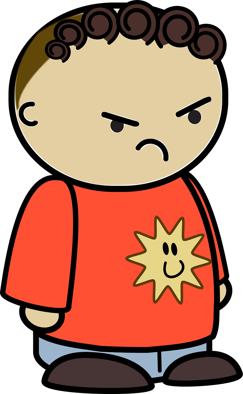Curly haired boy in a orange shirt, angry face, to the side